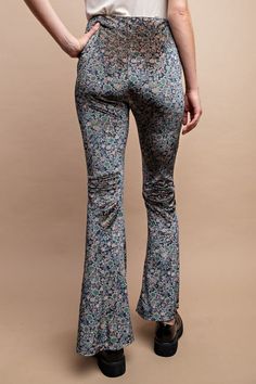 GigioFloral velvet pants with high waist and side zipper. Ditsy floral print, stretchy lightweight fabric, flare hem. Color: Midnight BlueSizes: S-M-LModel is 5' 8" wearing small95% Polyester, 5% Spandex, importedT4/TA2497 Fall Floral Print Full Length Pants, Floral Print Full-length Pants For Fall, Floral Print Flare Bottoms With Stretch, Stretch Floral Print Pants For Fall, Fitted Floral Print Pants For Fall, Fitted Floral Print Pants, Fitted Floral Print Long Pants, Fitted Floral Print Full-length Pants, Fitted Floral Print Full Length Pants