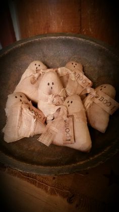 a bowl filled with burlocks sitting on top of a wooden table