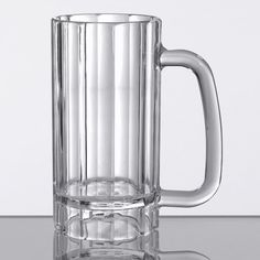 a large glass mug sitting on top of a table