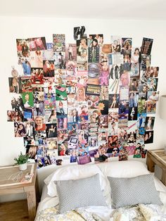 a bed topped with lots of pictures and pillows