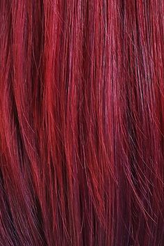 closeup of red hair with long, straight bangs on the top and bottom part