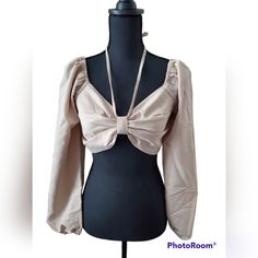 Taupe Long-Sleeve Cropped Top With Halter Neck Tie This Adorable Top Features A Pretty And Trendy Halter Neck Tie, Puffed Sleeves, And A Smocked Back! 90% Polyester 10% Rayon Approx. Length (Shoulder To Bottom Hem): Large: 13'' Approx. Bust Size: Large: 32 " Fits True To Size Halter Neck Tie V-Neck Long Sleeves Puffed Sleeves Crop Top Length Smocked Back Square Back Hand Wash Cold Hang Or Line Dry Color: Taupe No Flaws - New With Tags (Nwt) Comes From A Smoke Free Home I Ship Fast I Accept Offer Beige Stretch Long Sleeve Blouse, Chic Spring Crop Top With Long Sleeves, Chic Spring Crop Top Long Sleeve, Chic Long Sleeve Padded Crop Top, Chic Fitted Long Sleeve Top For Brunch, Chic Spring Long Sleeve Crop Top, Fitted Long Sleeve Top For Spring Brunch, Beige Puff Sleeve Top For Party, Beige Long Sleeve Blouse For Brunch