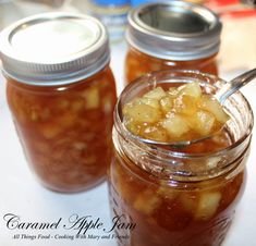 two jars filled with food sitting on top of a table