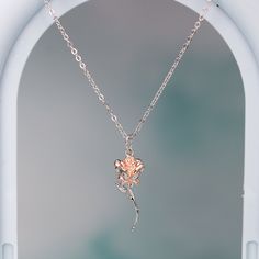 This exquisite rose pendant necklace showcases a 3D rose in 925 sterling silver with rose gold plating for a stunning flower color. It hangs delicately on a 925 sterling silver cable pendant with an adjustable ball. Make this elegant rose pendant necklace a part of your everyday fine jewelry collection, or gift it to a loved one for a special occasion. Materials: 925 sterling silverFinish: platinum plate, rose gold plateMaximum length is 17.5 inches, can be adjusted shorter using the adjustable ball. Jewelry Care: See more information about how to care for your jewelry here. Shipping Policy: Orders will be shipped within 1-3 business days. Economy shipping will take 7-14 days to arrive and standard shipping is 1- 4 days for U.S. orders. International shipping time is depended on the countr Sterling Silver Necklace With Rose Flower Pendant, Sterling Silver Rose Gold Jewelry With Rose Design, Elegant Rose Sterling Silver Necklace, Rose Pendant Necklace In Sterling Silver, Ball Jewelry, Rose Pendant Necklace, 3d Rose, Rose Pendant, Sterling Silver Necklace Pendants