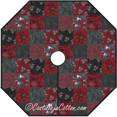 a red and black patchwork design with white flowers on the center, is shown