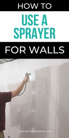 a man using a sprayer to paint the walls