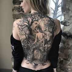 the back of a woman's body is covered in tattoos and features an image of a horse