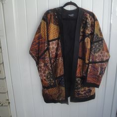 Gorgeous Lagan Look Printed Dolman Sleeve Jacket Lagen Look Printed 100% Cotton Long Open Jacket-Cardigan With Black Lining 2 Front Pockets----Dolman Sleeves Looks Brand New----Excellent Condition Fabric Looks A Little Like Tapestry--- Please Check Measurements Since No Size Label-- 28.5" Pit To Pit J33" Neckline To Hem 2.5" Black Trim At The Bottom Made In Indonesia Lagan Look Tapestry Long Open Kimono Jacket Traditional Silk Outerwear For Fall, Black Silk Outerwear For Fall, Multicolor Silk Kimono For Fall, Long Silk Outerwear For Fall, Bohemian Silk Outerwear For Winter, Bohemian Silk Winter Outerwear, Vintage Black Outerwear With Kimono Sleeves, Design Black Gold, Open Kimono