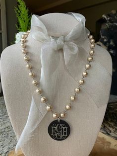 "Special sale!  This necklace usually sells for $56.  My supplier double-shipped me on the pearls so .... \"let's have a sale!\" The color is luscious...a warm ivory tone.   The disc is acid-washed silver and is engraved with 3 initials (free engraving).   19 inches with 1 1/2\" extension chain.  The lobster claw is of a decorative scroll-work design." Classic Personalized Pearl Jewelry, Silver Monogram Jewelry For Wedding, Elegant Personalized Pearl Jewelry, White Monogram Jewelry For Wedding, White Monogrammed Jewelry For Wedding, White Monogram Wedding Jewelry, Elegant White Monogram Necklace, Personalized Silver Pearl Necklaces, Customizable Silver Necklaces For Weddings