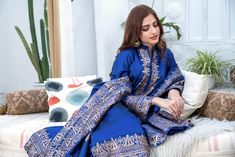 SKU: 1605 Price for Shirt, Pant and dupatta A Classic Royal Blue color ensemble with hand gold and screen print ensemble. The perfect ensemble can be worn at any occasion, Shirt length 42. Model is wearing S Blue Jamawar Lawn Suit For Festivals, Blue Jamawar Lawn Suit With Resham Embroidery, Traditional Blue Jamawar Lawn Suit, Blue Jamawar Lawn Suit With Dabka, Blue Anarkali Unstitched Jamawar Suit, Anarkali Blue Jamawar Salwar Kameez, Blue Embroidered Jamawar Sets, Blue Lawn Suit With Pallu For Eid, Blue Mulmul Lawn Suit With Zari Work