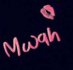 the word nom written in pink on a black background with an image of two lips