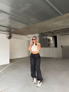 Black Drawcord Cargo Pants Easy and comfy in these black drawcord pants. Chuck on sneakers and a crop top - so effortless yet you're sure to look great! Relaxed Fit Cropped Bottoms For Streetwear, Sporty Cropped Bottoms For Streetwear, Casual Cropped Pants For Streetwear, Sporty Relaxed Fit Cropped Bottoms, Black Cropped Streetwear Bottoms, Cropped Black Streetwear Bottoms, Black Cropped Bottoms For Streetwear, Casual Black Cargo Workout Pants, Casual Black Cargo Pants For Workout