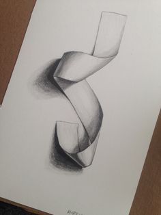 a pencil drawing of a curved object on paper