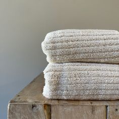 two white towels stacked on top of each other