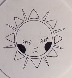 a white plate with a drawing of a sun on it