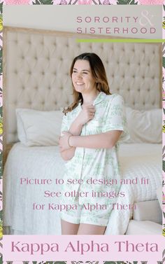 a woman standing in front of a bed with her arms crossed and smiling at the camera