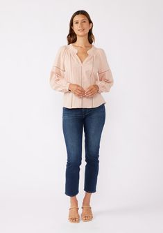 A cotton-blend bohemian blouse with embroidered details. Tonal Embroidered Cotton blend Relaxed fit Long sleeves Smocked elastic wrist cuff Split v-neckline with smocking Lace trim inserts Bohemian blouse Dry clean recommended or hand wash cold Tonal embroidered details add a delicate touch to this classic bohemian blouse. A lightweight and relaxed silhouette with long sleeves, smocked elastic wrist cuffs, and a flattering smocked split v-neckline. An effortless blend of classic elegance and boh Fall V-neck Peasant Top With Smocked Cuffs, Fitted V-neck Blouse With Smocked Cuffs, Feminine Cotton Blouse With Smocked Cuffs, Cotton Smocked Top With Smocked Cuffs, Peasant Style Cotton V-neck Blouse, Spring V-neck Smocked Top With Blouson Sleeves, Feminine Long Sleeve Cotton Peasant Top, Spring Peasant Top With Blouson Sleeves And V-neck, Cotton V-neck Peasant Top For Fall