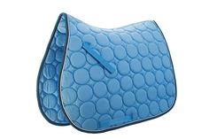 a blue saddle cover with circles on it