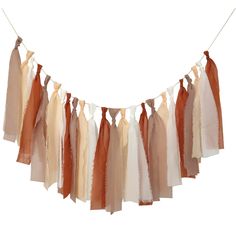 an assortment of scarves hanging from a line on a clothesline with string attached to it