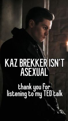 a man standing in front of a wall with the words kaz brekier isn't asexal thank you for listening to my ted talk