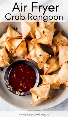 air fryer crab rangoon on a plate with dipping sauce