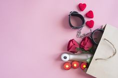 valentine's day gifts laid out on a pink background