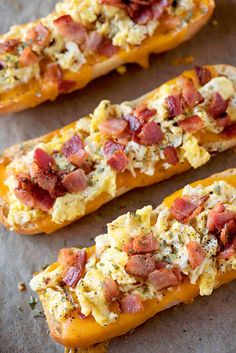 three pieces of bread topped with bacon and cheese