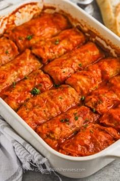 a casserole dish filled with meat and sauce