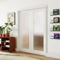 a living room with white walls and wooden floors