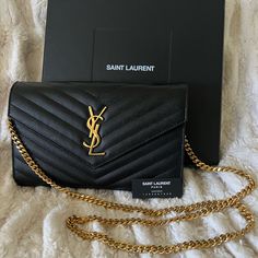 Stunning Authentic Saint Laurent Cassandre Matelass Chain Clutch Wallet In Grain De Poudre Embossed Leather! Perfect Handbag For Day Or A Night Out! Very Minimal Use And Kept In Pristine Condition! Chain Is Removable For Clutch/Wallet Style Or Wear With Gold Chain As A Should Bag Or Crossbody. Room For 10 Cards, Iphone, Some Makeup, Necessities Etc. Zippered Closure Area And Two Separated Pockets That Are Easily Accessible. Only Ever So Slight Wear Is The Saint Laurent Writing On The Inside Fold Of The Bag. Made With Metal-Free Tanned Leather With Flap Decorated With Metal Ysl Initials, Quilted Overstitching And Removable Shoulder Strap Chain. 70% Calfskin Leather, 30% Brass Makeup Necessities, Ysl Uptown Wallet On Chain, Ysl Mini Wallet On Chain, Ysl Envelope Chain Wallet, Saint Laurent Wallet On Chain, Ysl Clutch, Luxury Leather Wallet On Chain, Rectangular, Yves Saint Laurent Bags, Perfect Handbag