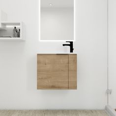 a bathroom with a sink, mirror and shelf on the wall next to each other