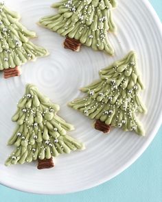 three decorated christmas trees on a white plate