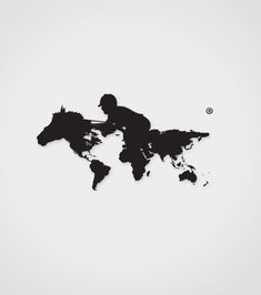 a black and white photo of a man riding a horse on the map of the world