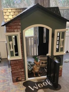 a dog is sitting in its kennel looking out the window at his owner's house