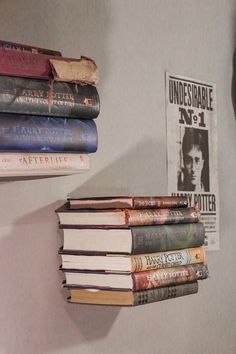 there are many books on the wall next to each other