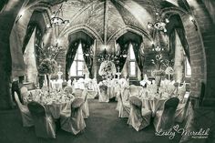 a black and white photo of a banquet hall