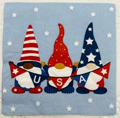 three gnomes with usa flags and stars on a blue background are featured in this quilted applique