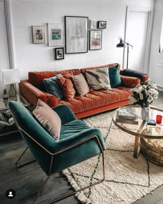 a living room filled with lots of furniture and pictures on the wall above it's coffee table