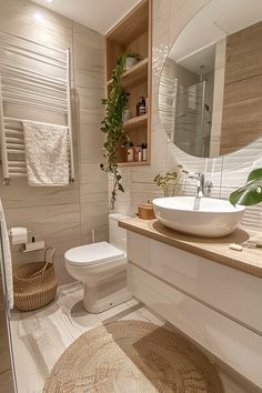 a bathroom with a toilet, sink and mirror in it's centerpieces