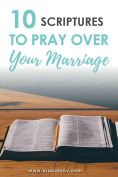 an open bible on top of a wooden table with the words 10 scripturess to pray over your marriage