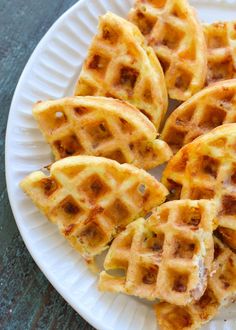 some waffles are sitting on a white plate