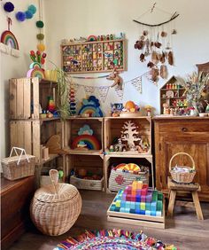 a room filled with lots of colorful toys and decor on the walls, including wooden crates