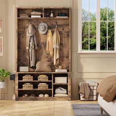 a bedroom with a bed, chair and coat rack