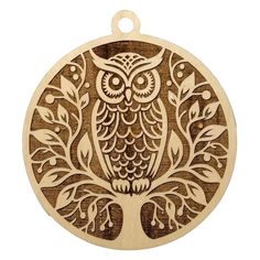 an owl ornament on a white background