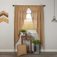 a living room with a window and two vases