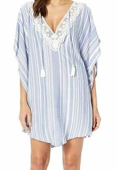 $103 Dotti Women's Blue Tassel Talk Striped Poncho Swimsuit Cover-Up Size Large  | eBay Casual V-neck Beach Poncho, Casual Spring Poncho With Tassels, Spring Long Sleeve Fringe Cover-up, Long Sleeve Fringe Cover-up For Spring, Fringe Poncho For Summer, Fringe Poncho For Vacation, Long Sleeve Fringe Beach Cover-up, Blue Tassel Tops For Beach, Beach Blue Tops With Tassels