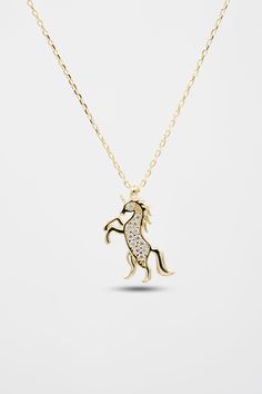 Unicorn Horse Gold Necklace Unicorn Horses are very noble animals, we combined this noble animal with gold and designed a necklace, you can easily wear this 14-karat gold necklace to any combination. Add a stylish gold necklace that you can buy to your loved ones to your cart without thinking and see the sparkle in your loved one's eyes. MATERIAL : 14K Gold. WEIGHT : 2,04 Grams COLORS : Gold - White - Rose Gold Each item is made to order. It is definitely not gold plated. Real 100% 14K Gold. The Gold Animal Design Necklace For Gift, Horse Design Pendant Necklace As Gift, Gold Pendant Necklace With Horse Design, Elegant Horse Design Pendant Jewelry, Luxury Horse Design Pendant Necklace, Gold Horse Design Pendant Necklace, Horse Pendant Necklace, Gold Animals, Unicorn Necklace