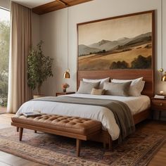 a bedroom with a large painting above the bed