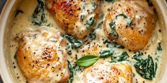 chicken with spinach and cheese in a white sauce