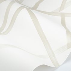 a white wallpaper with wavy lines on it